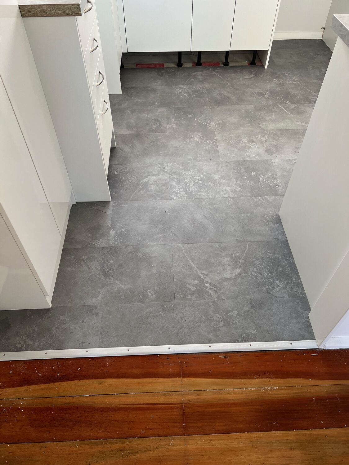 Vinyl flooring around a bathroom vanity